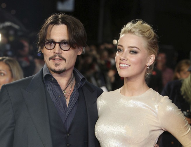 Johnny Depp's ex-wife asks judge to dismiss his lawsuit