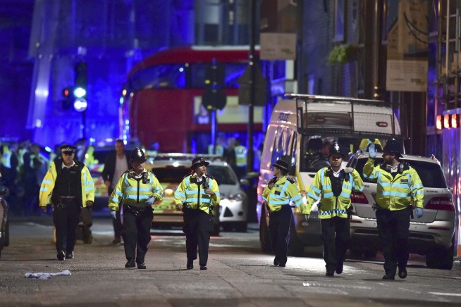 The Latest: Police: 6 die in attack; police kill 3 suspects