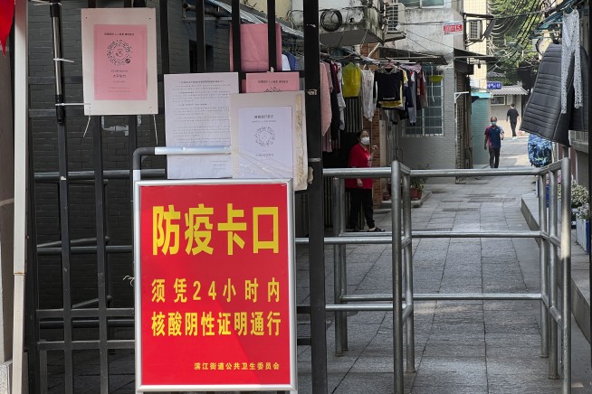 China eases some quarantine for travelers even as cases rise