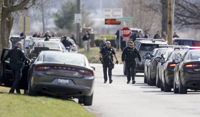 Court worker serving an eviction notice and a police officer fatally shot in Missouri, police say