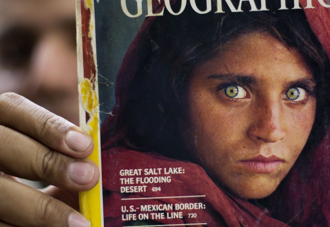 Afghan girl from famous cover portrait is evacuated to Italy