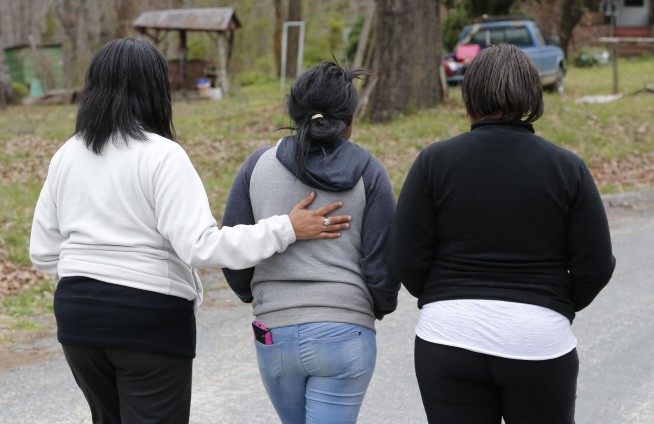 Truck carrying mulch hits, kills 2 children near bus stop