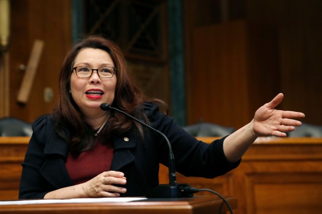 The Latest: Duckworth and daughter make Senate history