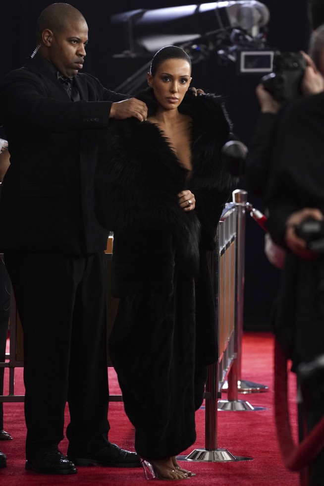 Sparkle and color pop amid more subdued tones on Grammys red carpet