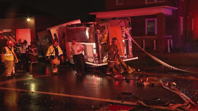 2 fire tanker trucks heading to large warehouse blaze crash, injuring 7 firefighters