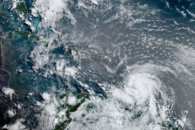 Elsa strengthens into season's 1st hurricane in Caribbean