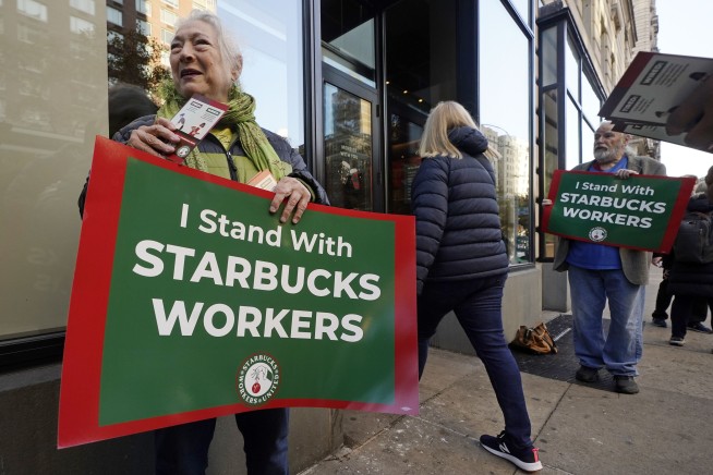 Thousands of Starbucks workers go on a one-day strike on one of the chain's busiest days of year