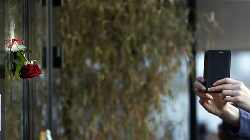 The Latest: Syrian passport in Paris traveled Balkans route