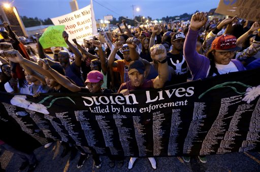 Police deploy tear gas to impose Ferguson curfew