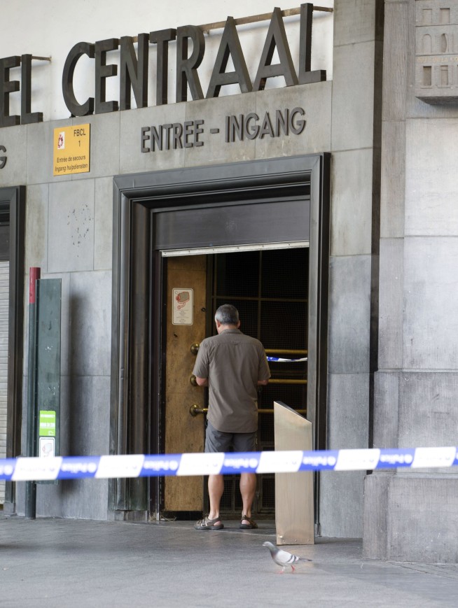 The Latest: Police raid home of Brussels attack suspect