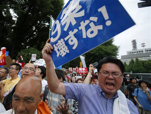 Japan's lower house of parliament OKs expanded military role