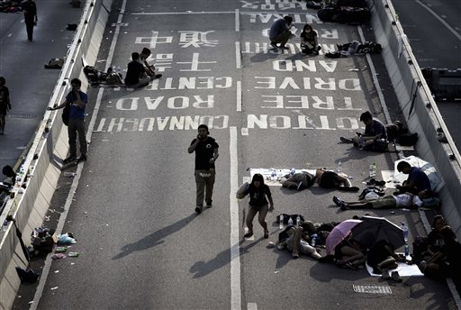 Hong Kong leader says Beijing won't back down