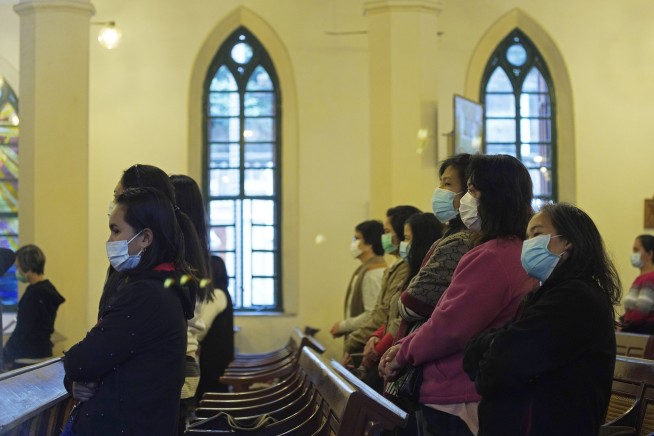 No handshakes: Viral outbreak spooks Asian places of worship
