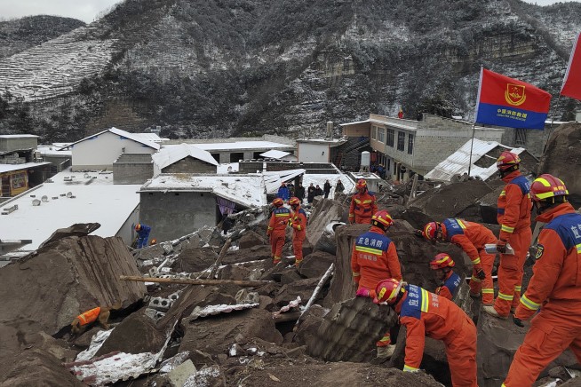 Two survivors rescued after landslide buried homes in freezing weather in southwest China, 11 died