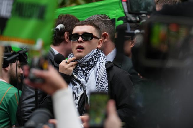 A British court throws out a terror-related charge against a member of the Irish rap group Kneecap