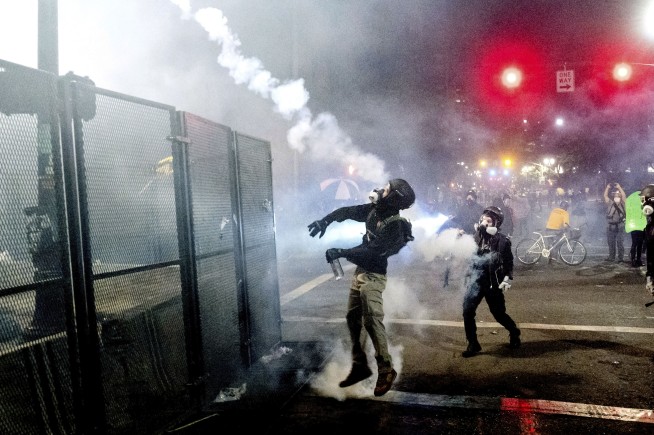 Federal agents use tear gas to clear Portland protest