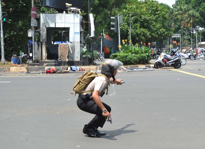 The Latest: Police say black IS flag was on Jakarta attacker