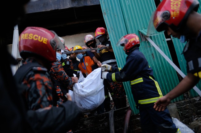 52 dead in Bangladesh factory fire as workers locked inside