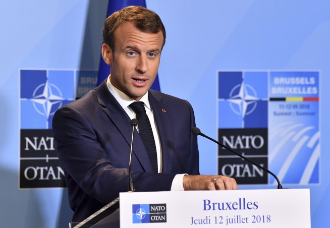 The Latest: Macron says Trump didn't threaten to leave NATO