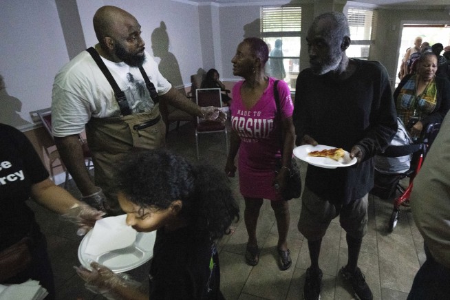 Some in Houston facing no power for weeks after storms cause widespread damage, killing at least 4