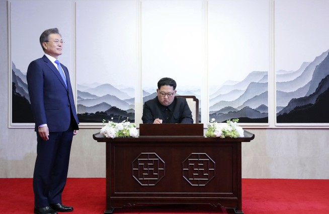 The Latest: Koreas agree to stop cross-border hostile acts