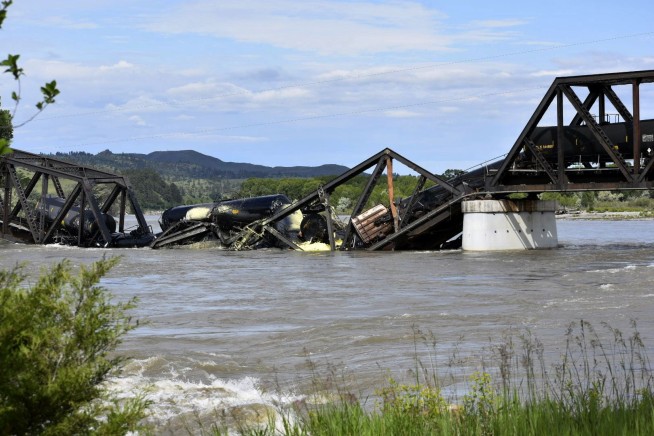 Freight train carrying hot asphalt, molten sulfur plunges into Yellowstone River as bridge fails