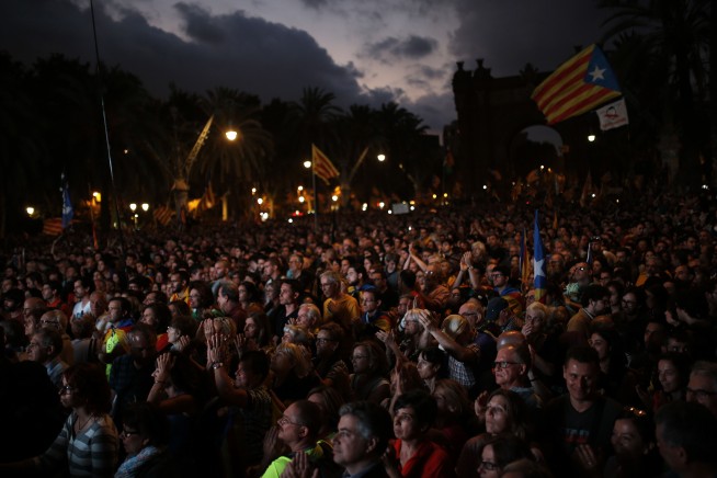 Catalan leader stakes claim to independence, then delays it