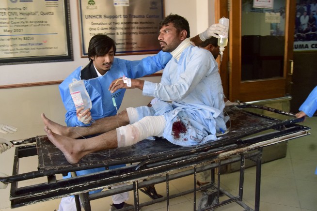 A powerful suicide bombing at a rail station in southwestern Pakistan kills at least 26