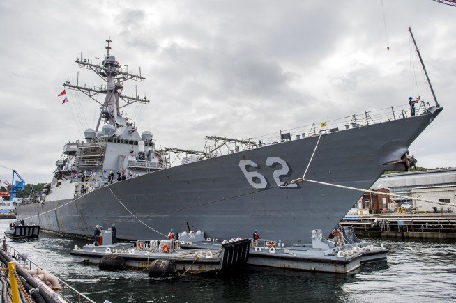 The Latest: Report says 1 hurt, 7 missing from US Navy ship