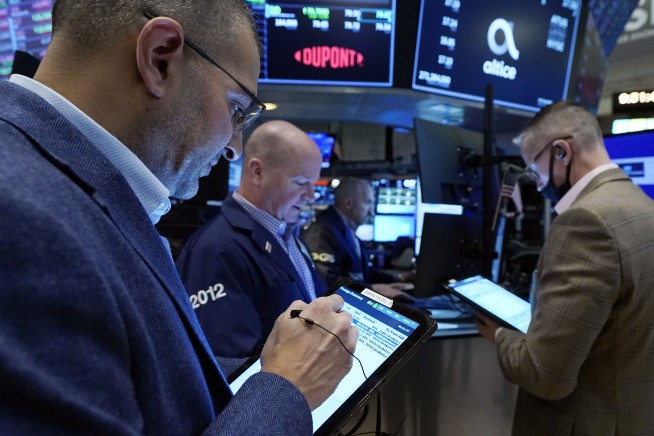 Stocks wobble as Wall Street heads for a mixed weekly finish