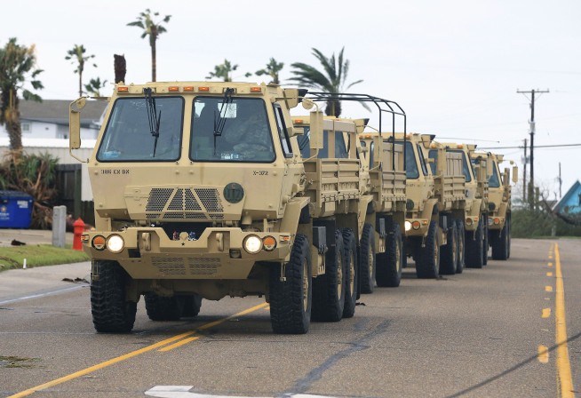 The Latest: Coast Guard rescues 18 from boats, barge