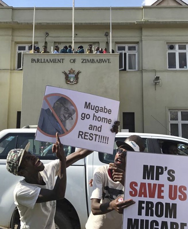 The Latest: Mugabe resigns for 'smooth transfer of power'