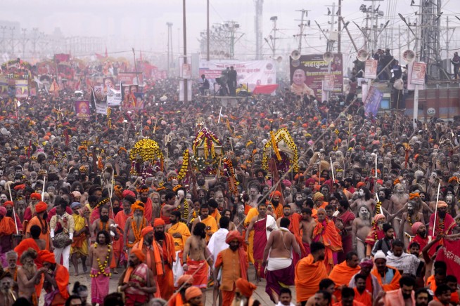 Millions of pilgrims and naked, ash-smeared ascetics take holy dips in India's mega Hindu festival