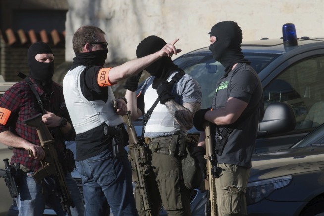 Germany seeks motive after van crashes into crowd, killing 2