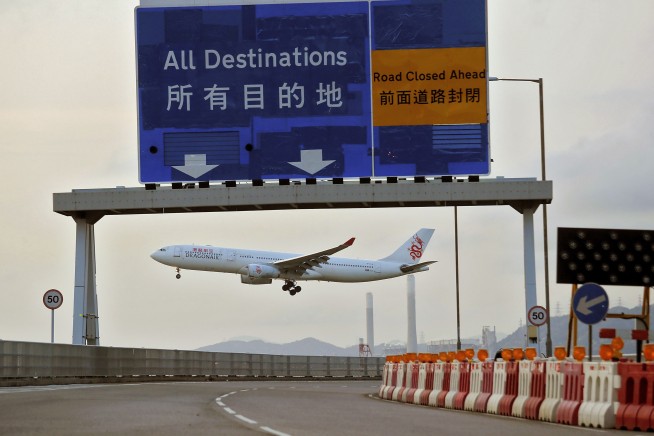 Riot police clash with protesters at Hong Kong airport