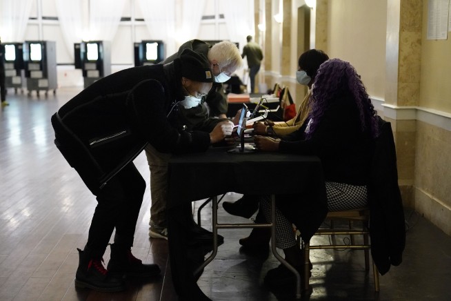 Georgia counting ballots in crucial Senate runoff elections
