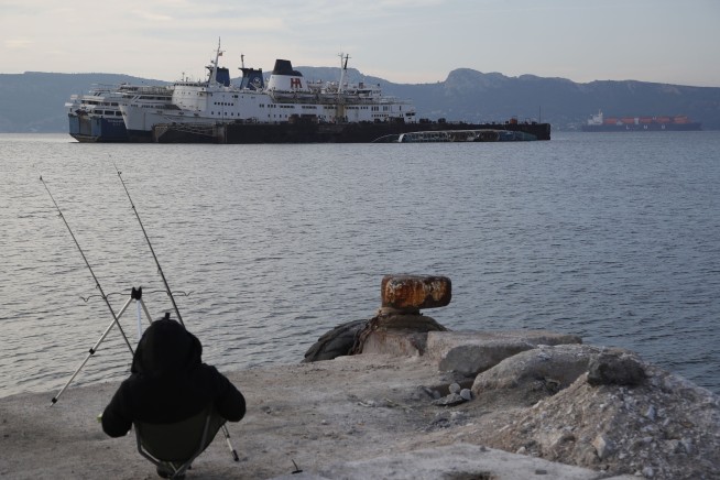 Greece hauls abandoned, half-sunken ships out of the sea