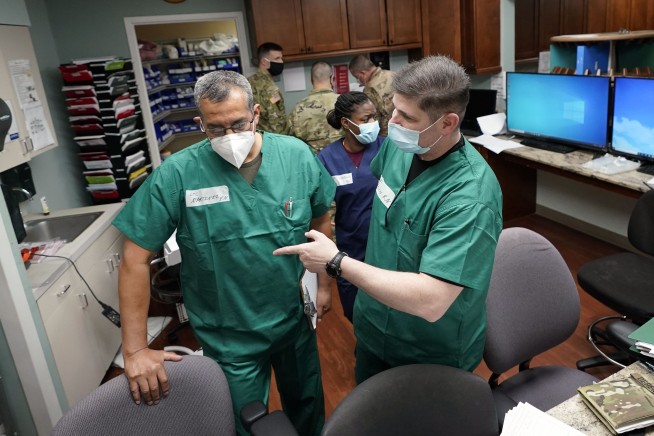 As virus surges in some US states, emergency rooms swamped