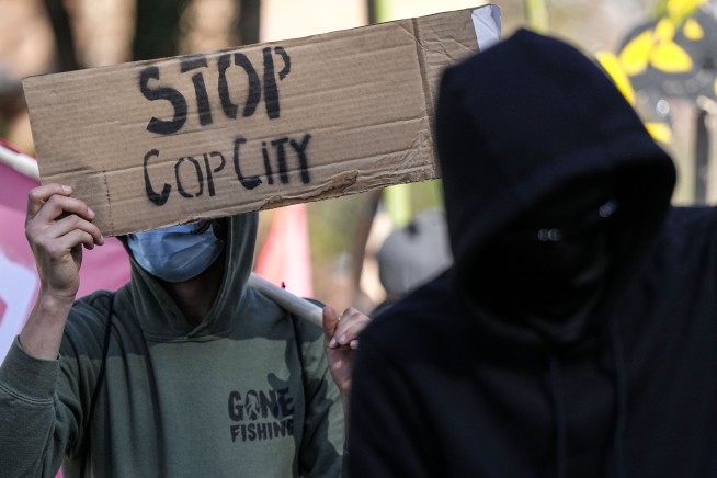 Police and protesters clash at Atlanta training center site derided by opponents as 'Cop City'