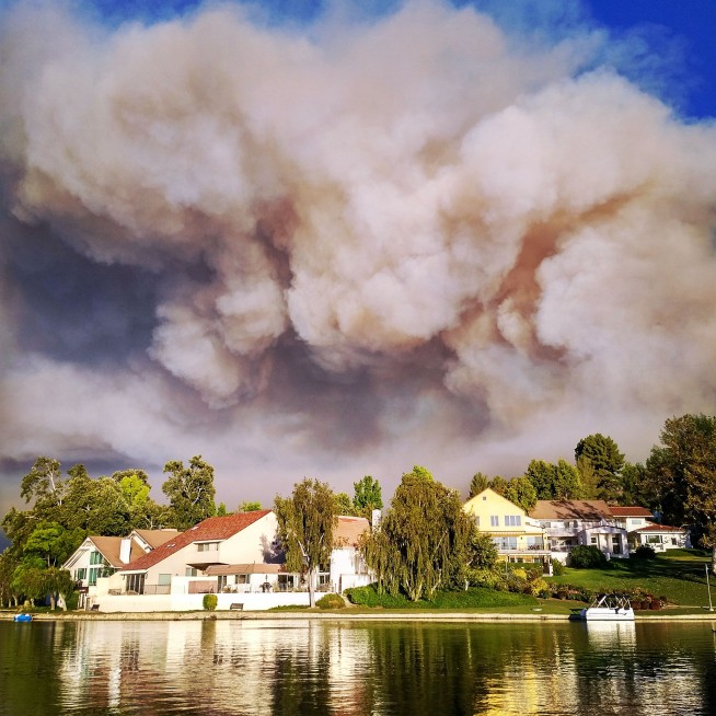 Southern California brushfire forces thousands from homes