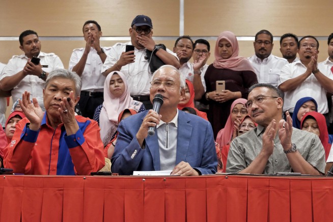 Defeated Malaysian leader, wife barred from leaving country