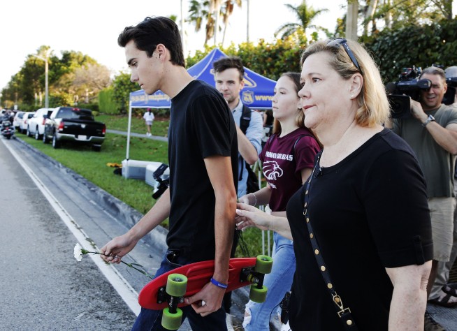 The Latest: Returning students told to not bring backpacks