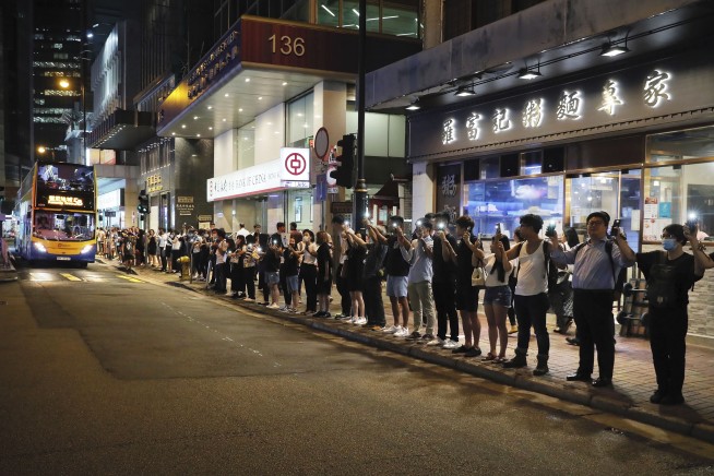 Hong Kong protesters form human chains to call for democracy
