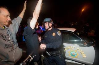 Cop Pulls Gun on Oakland Protesters