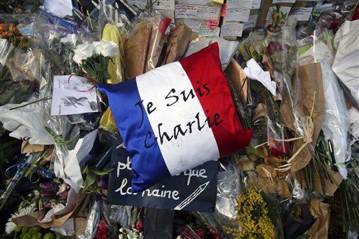 Policewoman Among 4 Held in Paris Terror Attacks