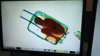 Woman Caught at Airport Carrying Boy in Suitcase