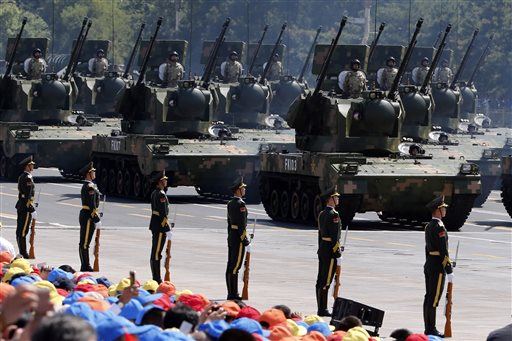 China Holds Huge Military Parade, Pledges to Cut Army