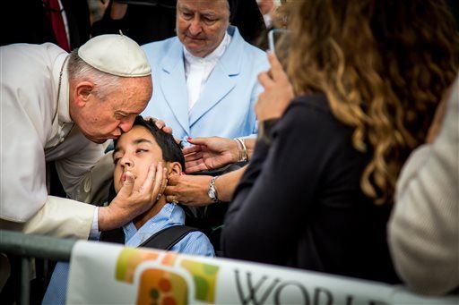 Pope Stops Car to Bless Boy in Wheelchair
