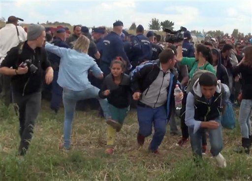 Camerawoman Who Tripped Refugee: I'll Sue Him