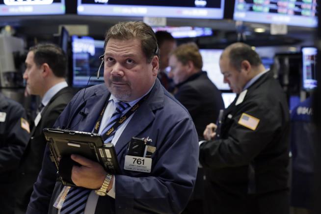 Dow Rebounds, Ends Day Up 115